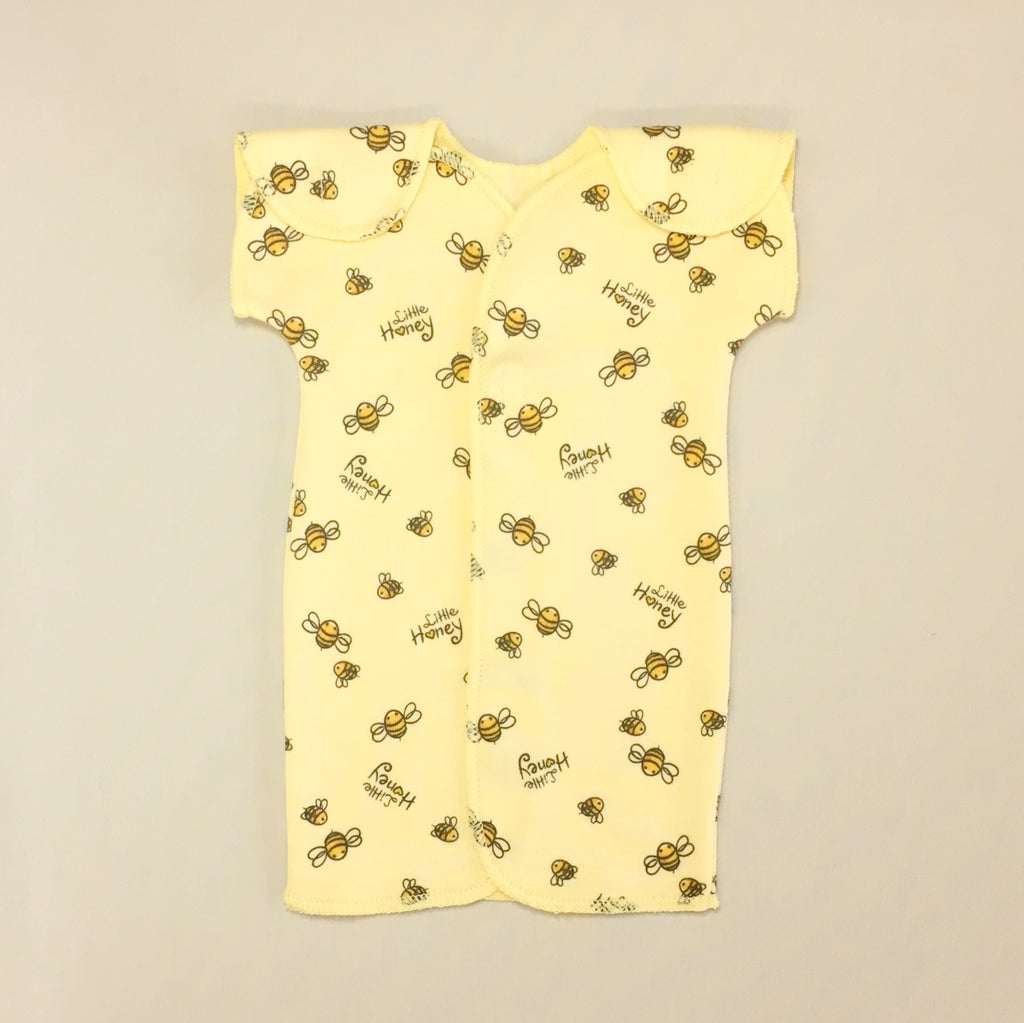 Yellow Baby gown with bumble bee pattern and velcro straps on shoulder